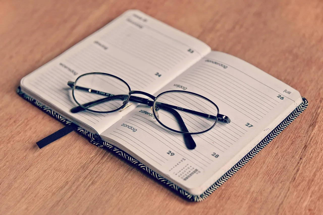 agenda, note book, schedule, planner, organizer, memo, appointment, deadline, day, glasses, spectacles, vision, eye, see, brown book, brown books, brown eye, brown glass, brown glasses, brown schedule, brown note, brown vision, agenda, agenda, agenda, schedule, schedule, schedule, planner, planner, planner, planner, planner, appointment. Scheduling escape room work so nothing slips